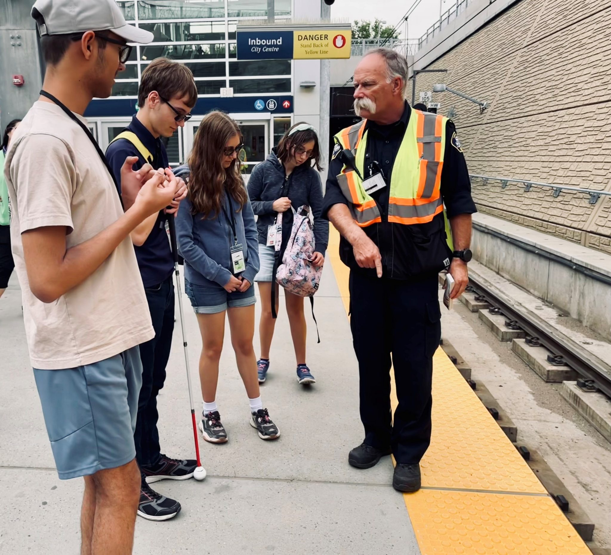 stand behind the yellow line